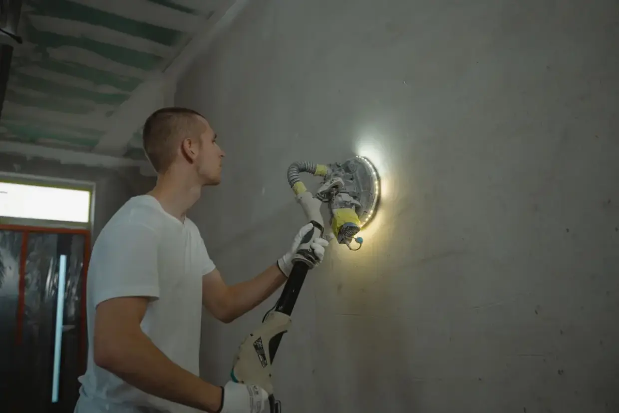 Drywall repair sanded flush with the surrounding wall surface