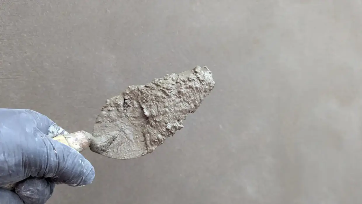 Plaster surface smoothed with a trowel during repair