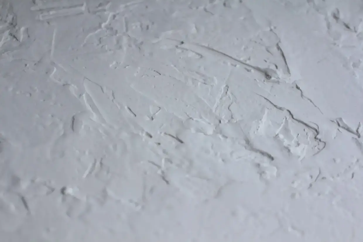 Popcorn textured ceiling surface before removal begins